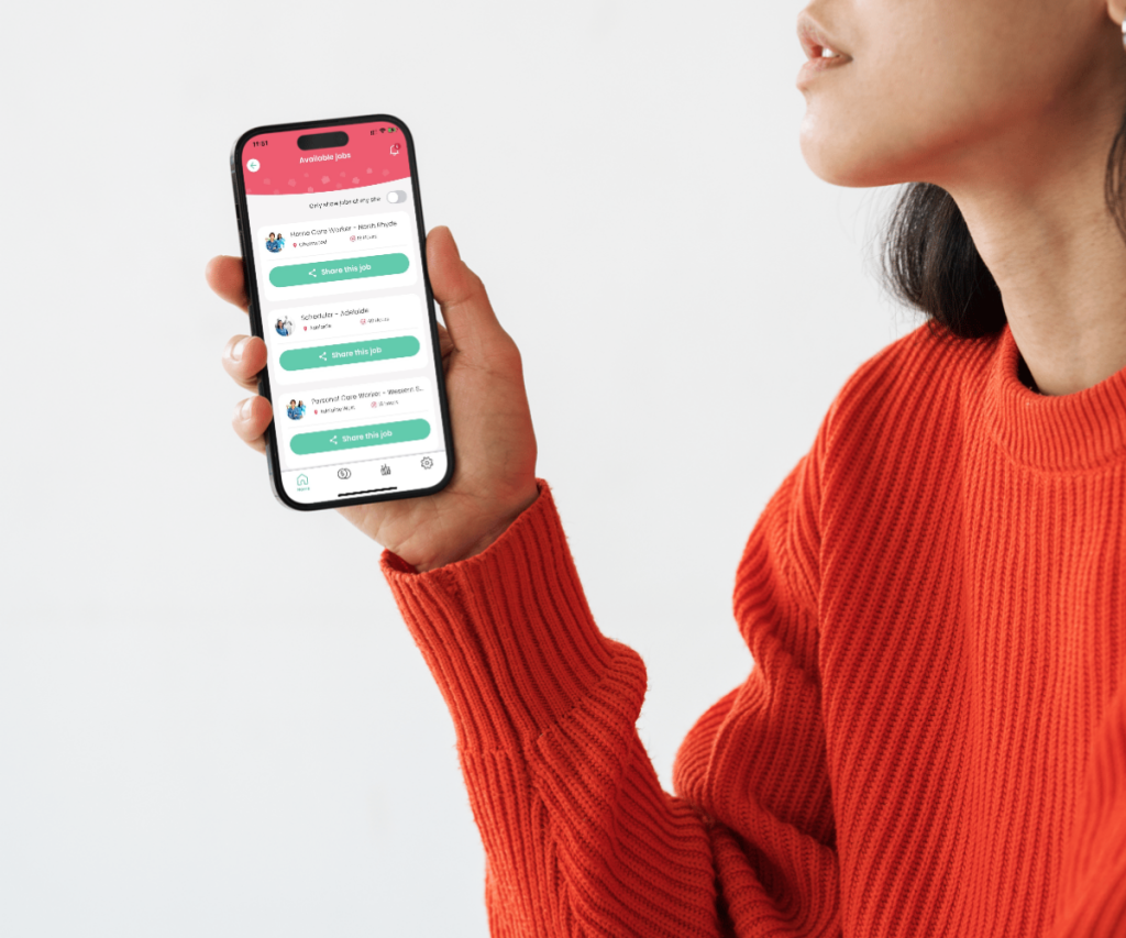 Woman with orange shirt holding on to phone